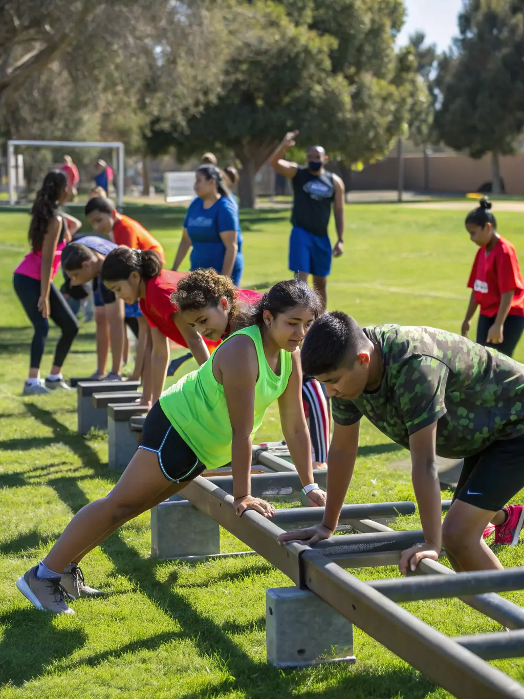 A group of participants navigating an obstacle course during a SPORTS PALANGES NATURE adventure race, highlighting teamwork and the spirit of overcoming challenges.